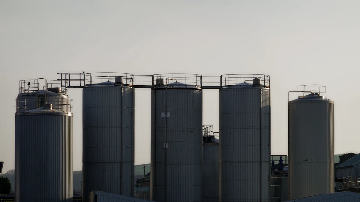 Industrial processing facility with effluent treatment pond and continuous monitoring equipment