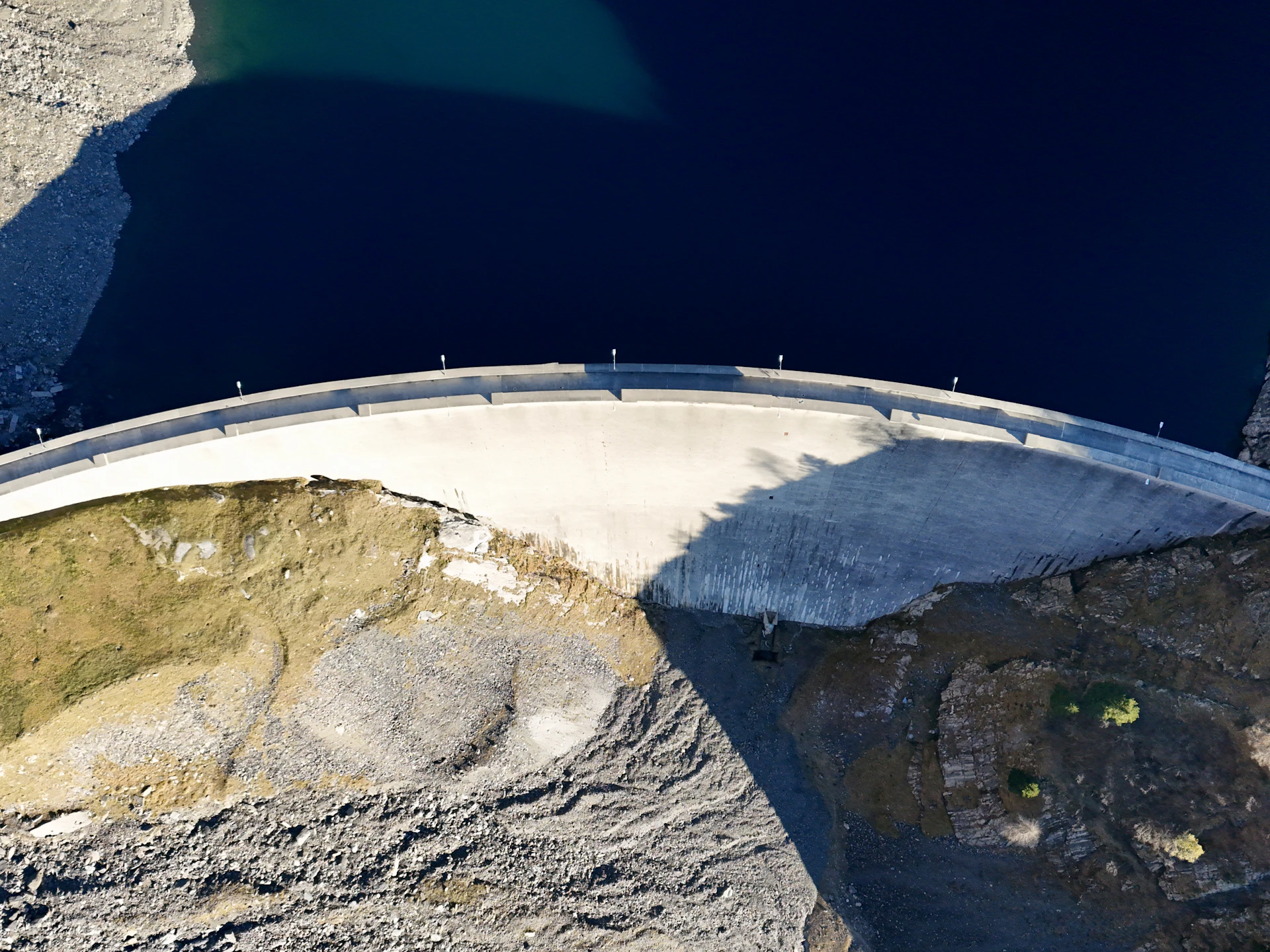 Aerial view of a river system winding through industrial and natural landscape at dusk