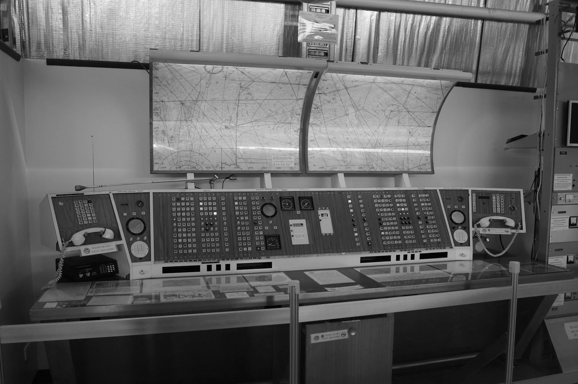 Environmental monitoring dashboard on screen showing real-time water quality data across multiple sites