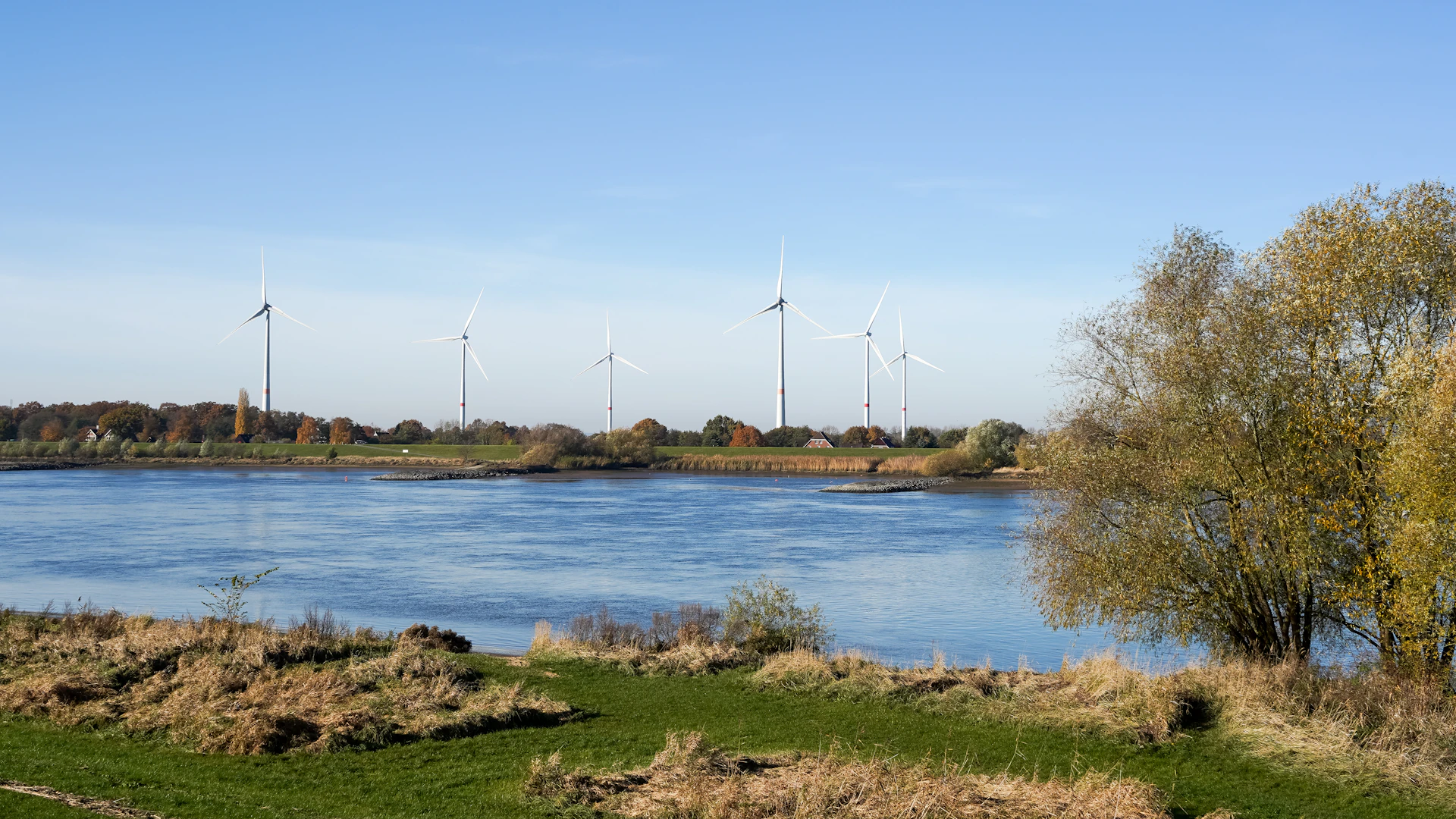 Underwater view of clean flowing water with monitoring sensor visible near riverbed